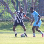 Mbabane Highlanders AM skipper Sandziso Dlamini tries to protect his ball as Banele 'Neymar' Shongwe of Royal Leopard closes in. Leopard won the match 2-0.