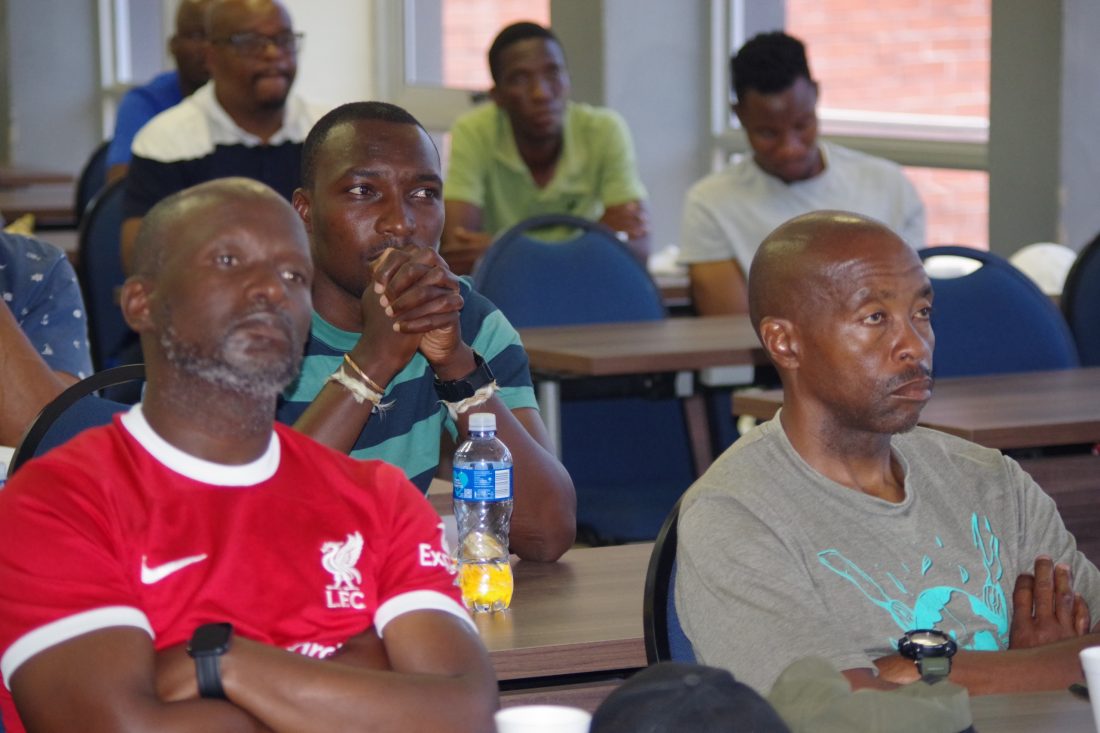 Moneni Pirates South African tactician Selaotse 'Sly' Mosala (R) follow proceedings of the coaches AGM at Sigwaca House in Mbabane on Sunday. (Pic: Nimrod Hlophe)