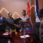 1. Lesotho Senate President being presented with gift by Minister for Tinkhundla Administration and Development Sikhumbuzo Dlamini.