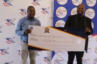 Melisizwe Zwane(R) receiving his E5 000 from Eswatini Med Principal Officer Sicalo Mkhonta