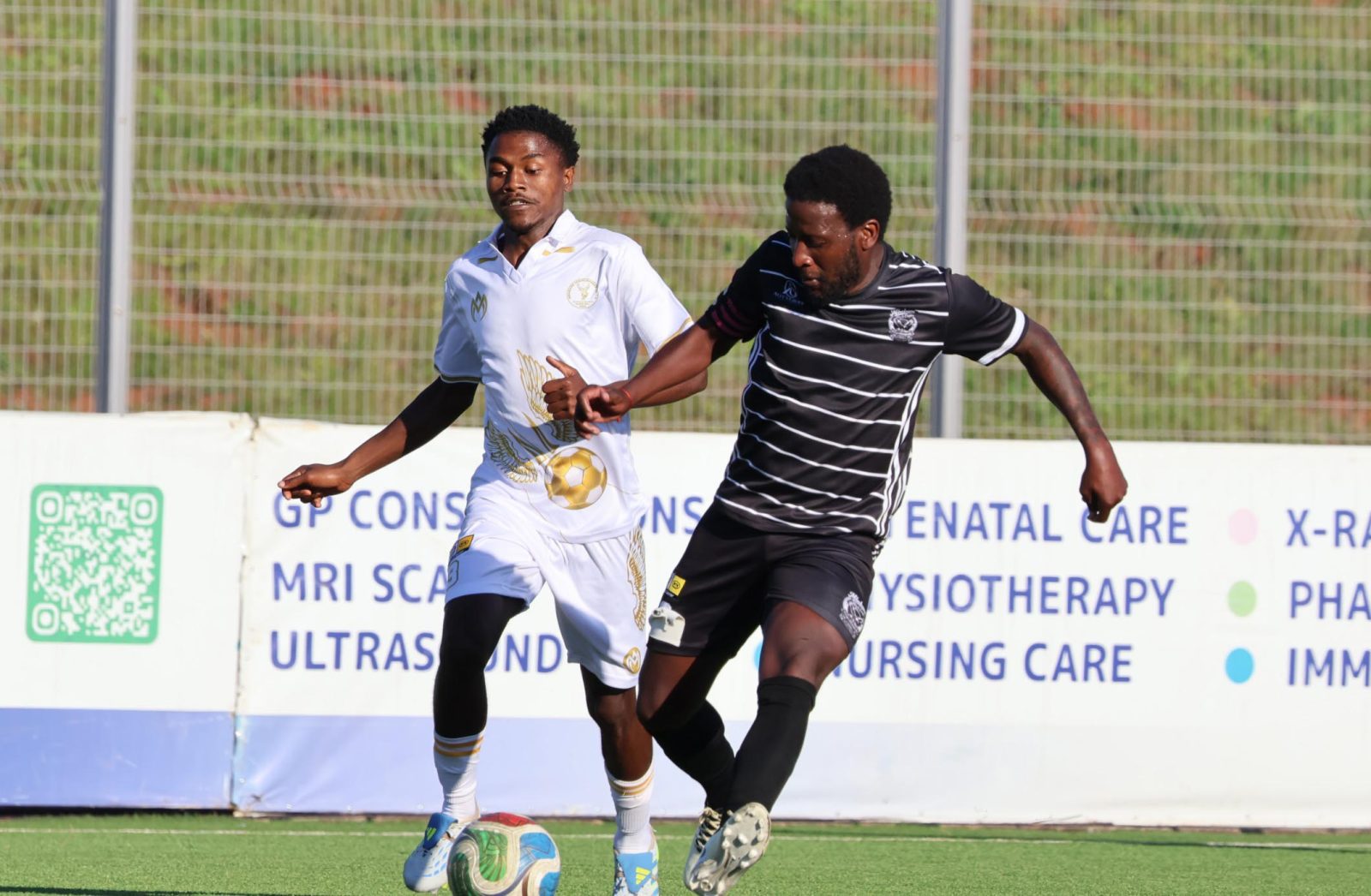 Former Kaizer Chiefs midfielder Siphelele Ntshangase wrestles for the ball against Nuno Dos Santos of Mbabane Highlanders AM. Ntshangase scored a spectacular goal against Madlenya today on October 23, 2026. (Pic:Times of Eswatini)