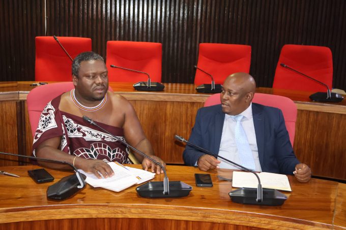 Minister for Public Works and Transport Chief Ndlaluhlaza Ndwandwe and Under Secretary Richard Phungwayo having a chat before presenting the proposed bus and taxi hike fares to senators yesterday.